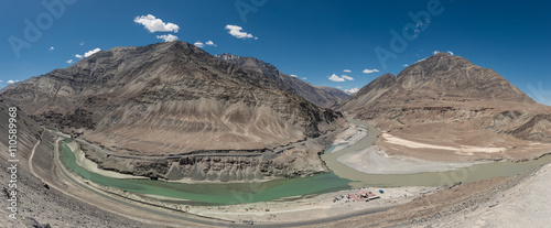 Panorama Scenic view of Confluence of Zanskar river from left and Indus rivers from up right - Leh, Ladakh, Jammu and Kashmir, India. photo