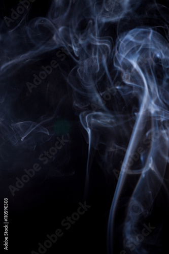 White smoke on a black background.