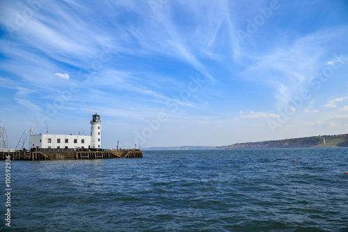 Fototapeta Naklejka Na Ścianę i Meble -  Scarborough lighthouse viewed from the harbour. In Scarborough, England. On 5th May 2016.