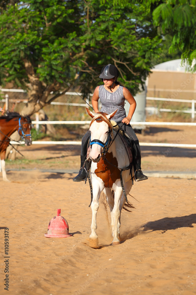 girl is riding a horse