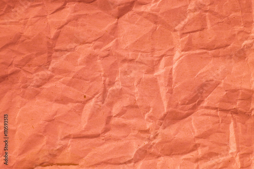 Red crumpled paper texture for background.