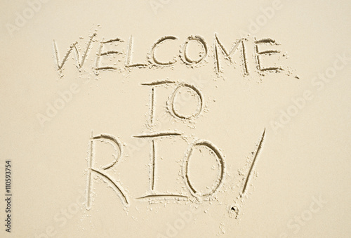 Welcome to Rio (as in, de Janeiro) message handwritten in smooth sand on the beach in Ipanema