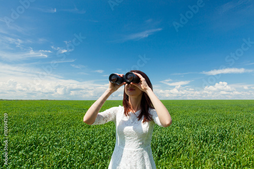 young woman with binocular