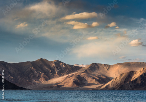 india, It is 134 km long and extends from India to Tibet. Leh, Jammu and Kashmir, ladakh, Pangong tso (Lake) with blue sky in background. It is huge lake in Ladakh, scenic © candyhalls