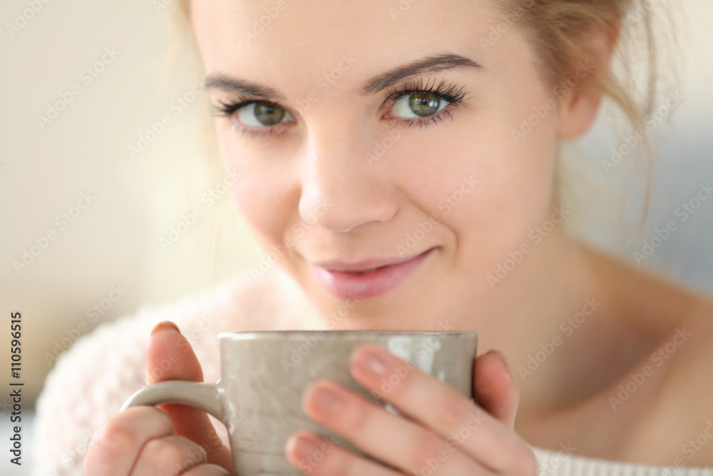 Blonde beautiful girl enjoying her cup of hot delicious coffee Blonde beautiful girl enjoying her cup of hot delicious coffee