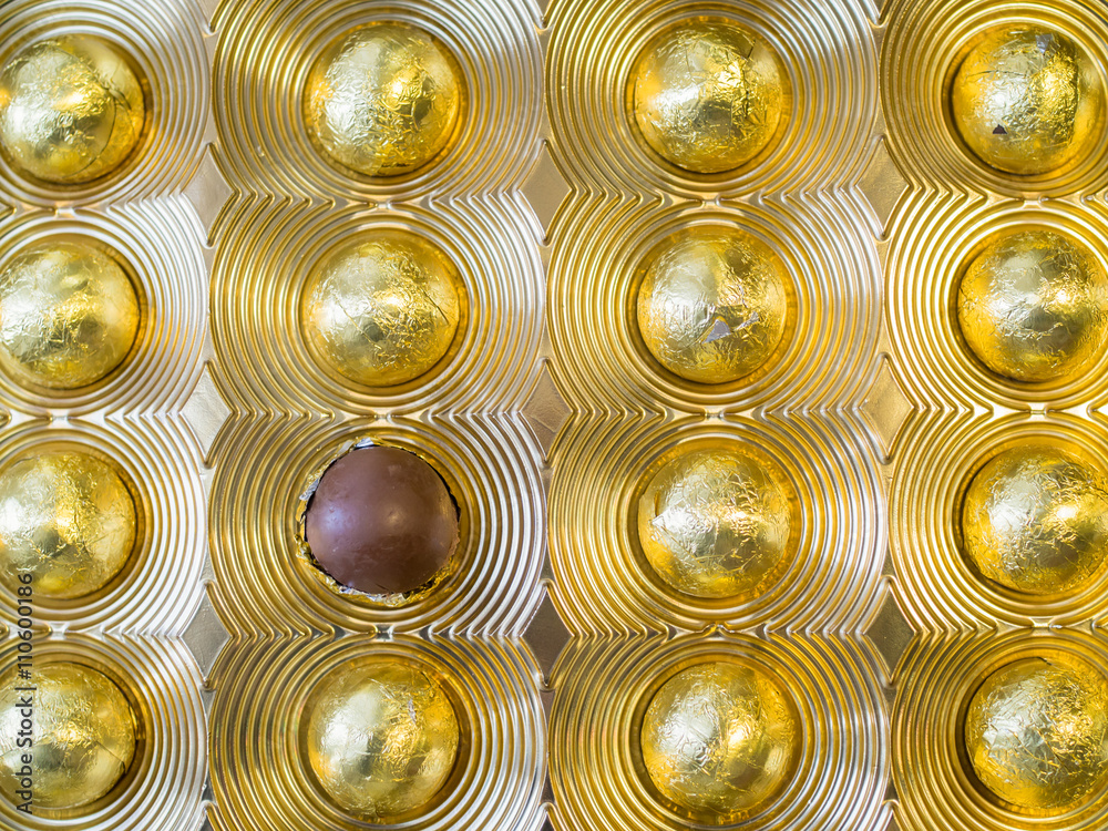Chocolate dessert in gold metalic foil Chocolate dessert in gold metalic foil