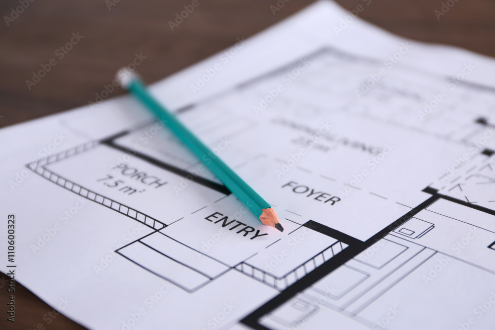 Construction drawings with pencil on wooden table closeup Construction drawings with pencil on wooden table closeup
