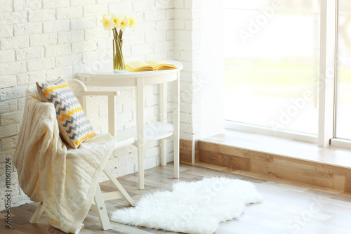 Beautiful narcissus on white wooden table