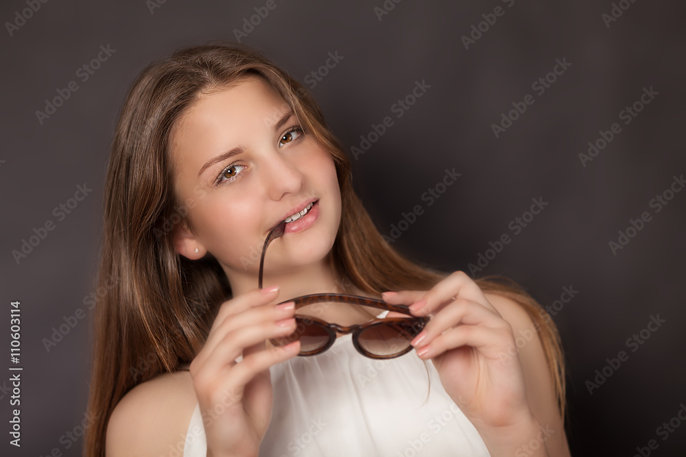 Girl with sun glasses looking in the camera
Girl with sun glasses looking in the camera