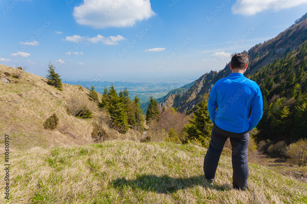 Man on top of mountain