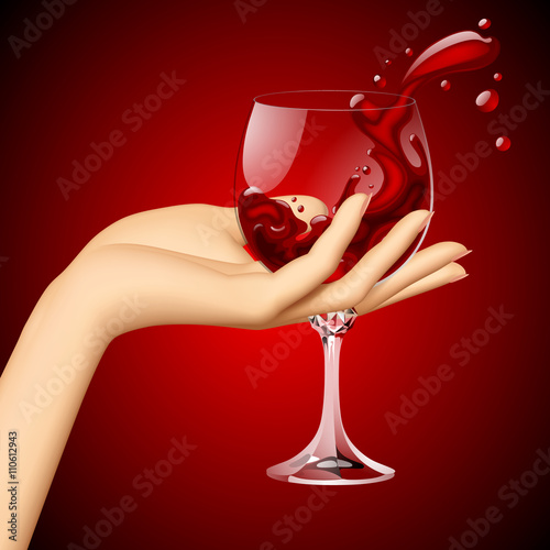 Woman's hand with red wine in the glass on dark red background