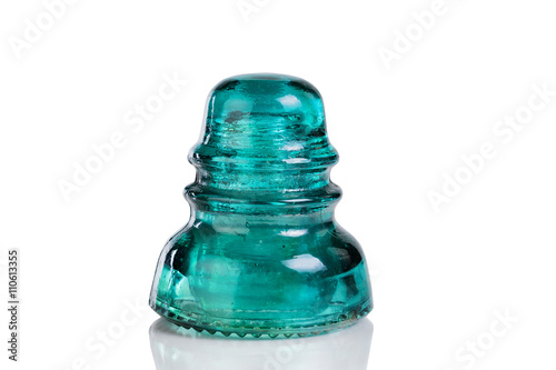 Vászonkép Antique glass insulator isolated on white background