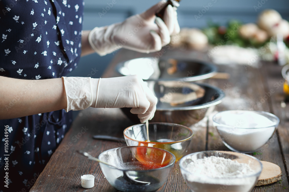 Preparation of bath bombs. Ingredients and floral decor on a wooden vintage table.