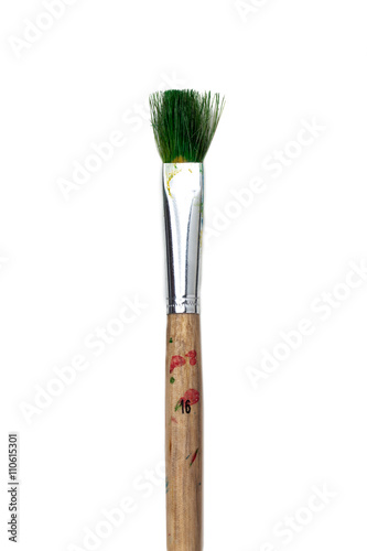 cropped image of a stained paintbrush over white.