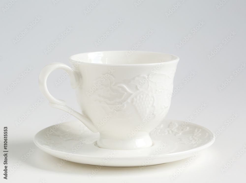 white cup and saucer white cup and saucer