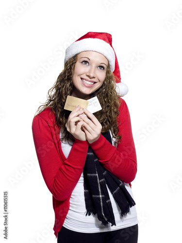 young woman with credit cards looking away.