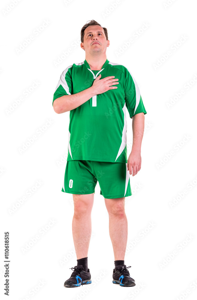 Mature man dressed in green sportswear posing Mature man dressed in green sportswear posing