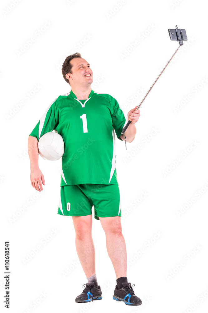 Mature man dressed in green sportswear posing Mature man dressed in green sportswear posing