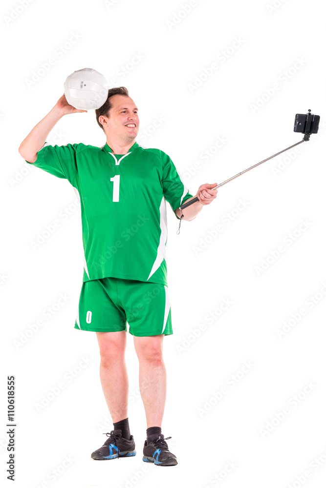Mature man dressed in green sportswear posing Mature man dressed in green sportswear posing