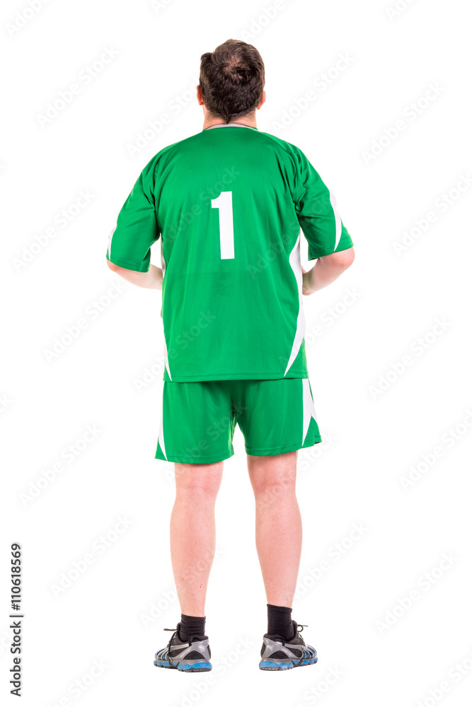Mature man dressed in green sportswear posing
