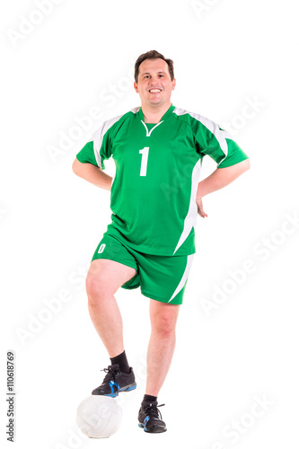 Mature man dressed in green sportswear posing