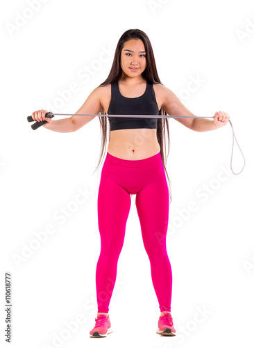 Young asian woman in sportswear posing