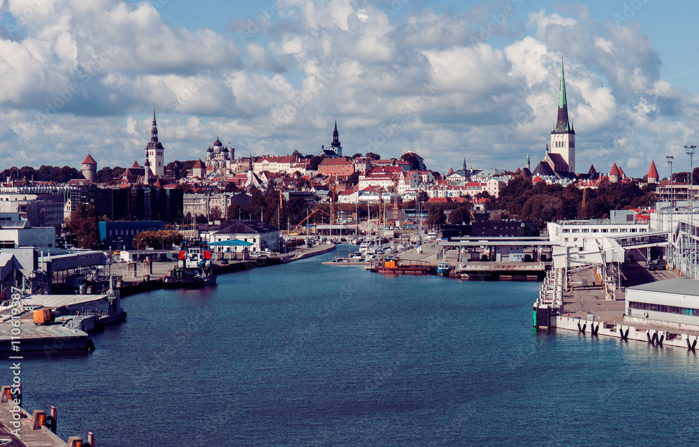 Vintage tinted snapshot of the Old Town and sea harbor in Tallinn, Estonia. Talinn sityscape