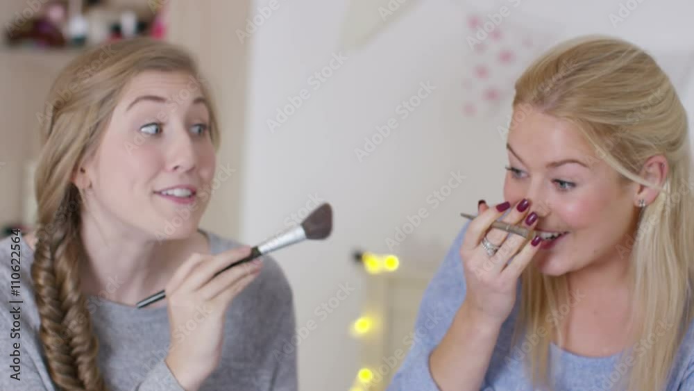  Teenage girls hanging out in bedroom, putting on make up & chatting
