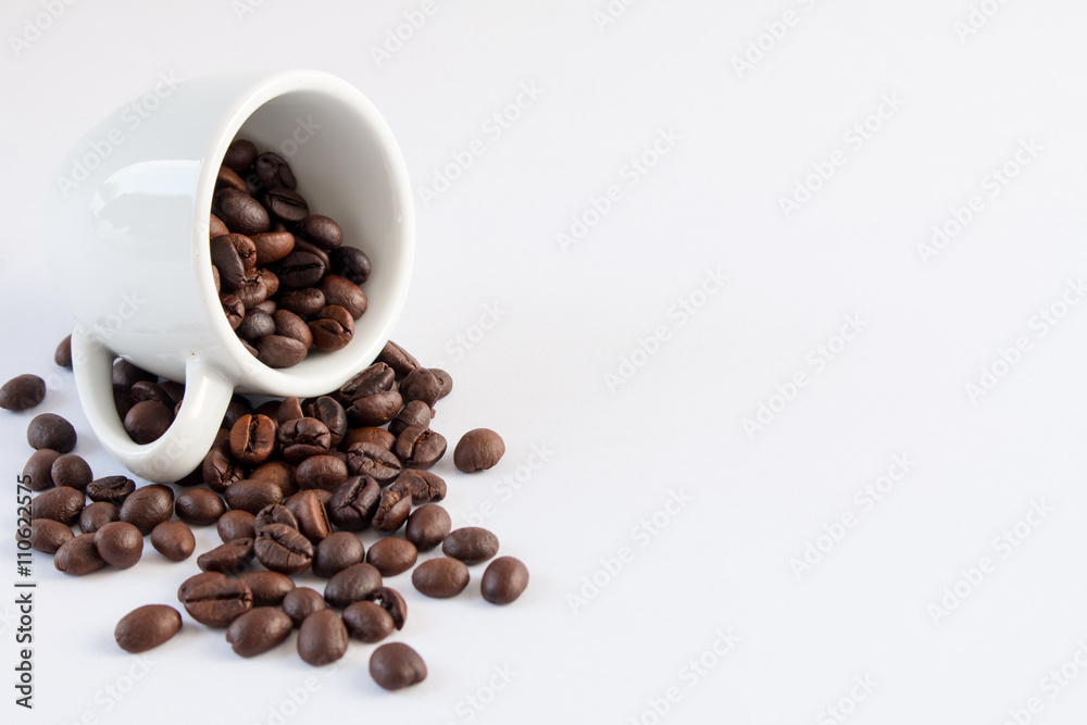Coffee beans in coffee cup white background Coffee beans in coffee cup white background