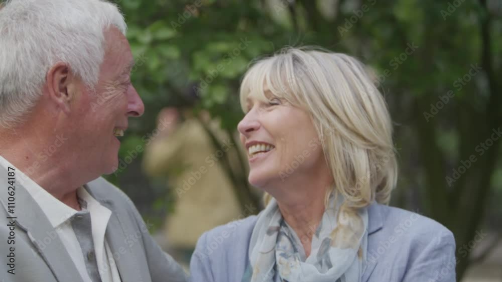Portrait of happy mature couple in love, outdoors urban park area Portrait of happy mature couple in love, outdoors urban park area