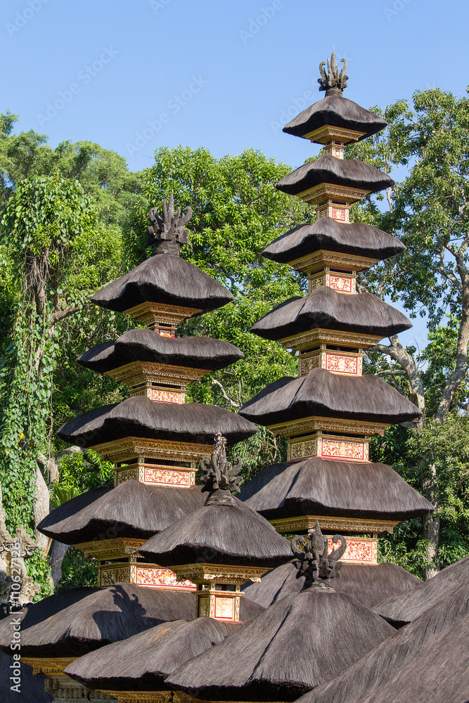 Thatched roof Hindu temple in city Ubud, Bali, Indonesia Thatched roof Hindu temple in city Ubud, Bali, Indonesia