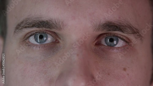 Close up on the eyes of a attractive young man photo