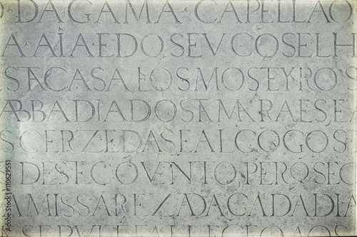 Vintage image of background of old wall with latin inscriptions