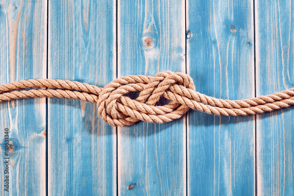 Natural Rope Double Figure Eight Knot on Blue Wood Stock Photo