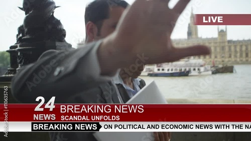  Couple in business dress in London being bothered by news reporter