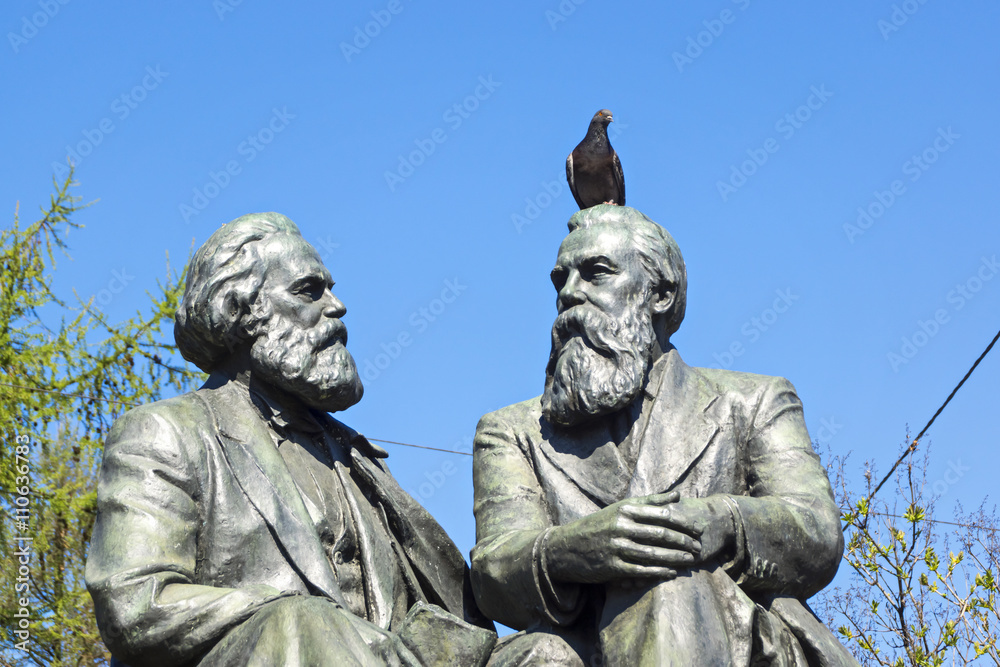 Pigeon bird on head of statue Pigeon bird on head of statue