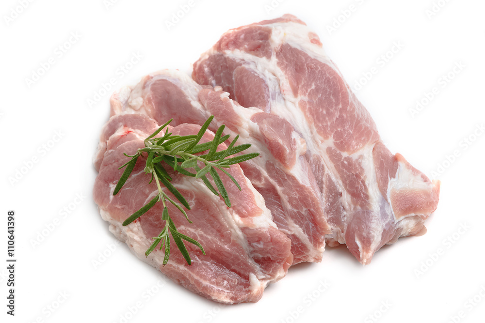 Raw pork meat steaks with spices on the white background.