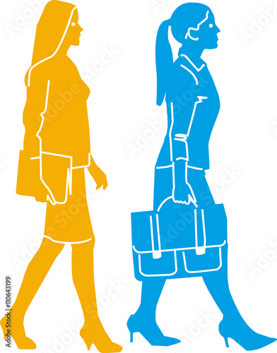 two businesswomen walking in a row