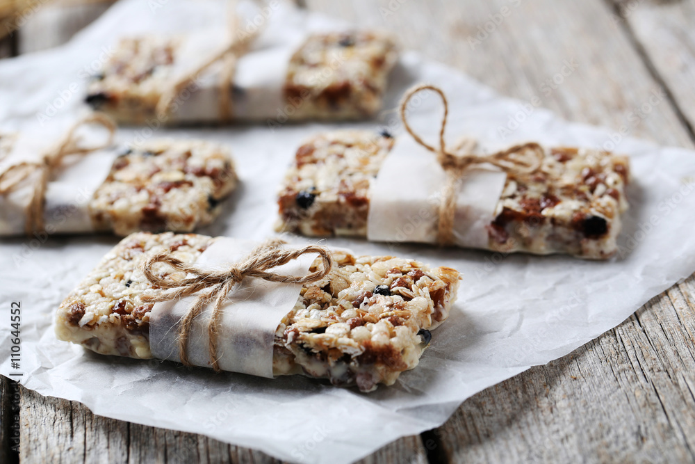 Granola bar on a grey wooden table Granola bar on a grey wooden table