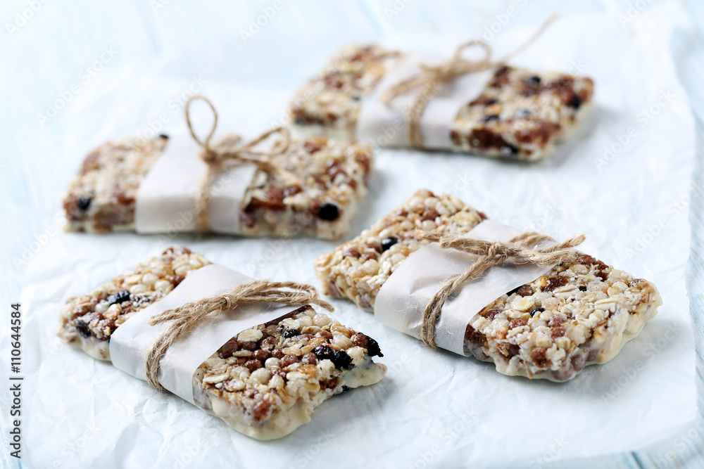 Granola bar on a blue wooden table Granola bar on a blue wooden table