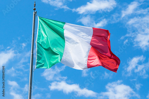 Waving flag of Italy and blue sky 