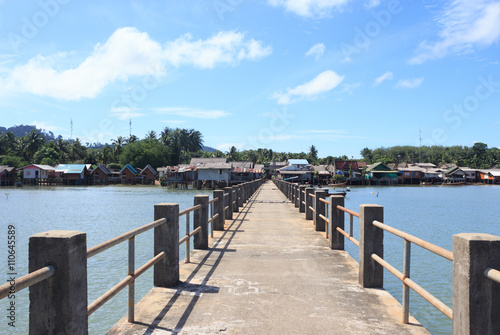 old wooden and concrete bridge to dock pier tranquil sea destination,Trang Thailand