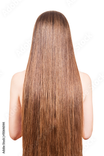 The girl with well-groomed, smooth, long, brown hair isolated on white 
