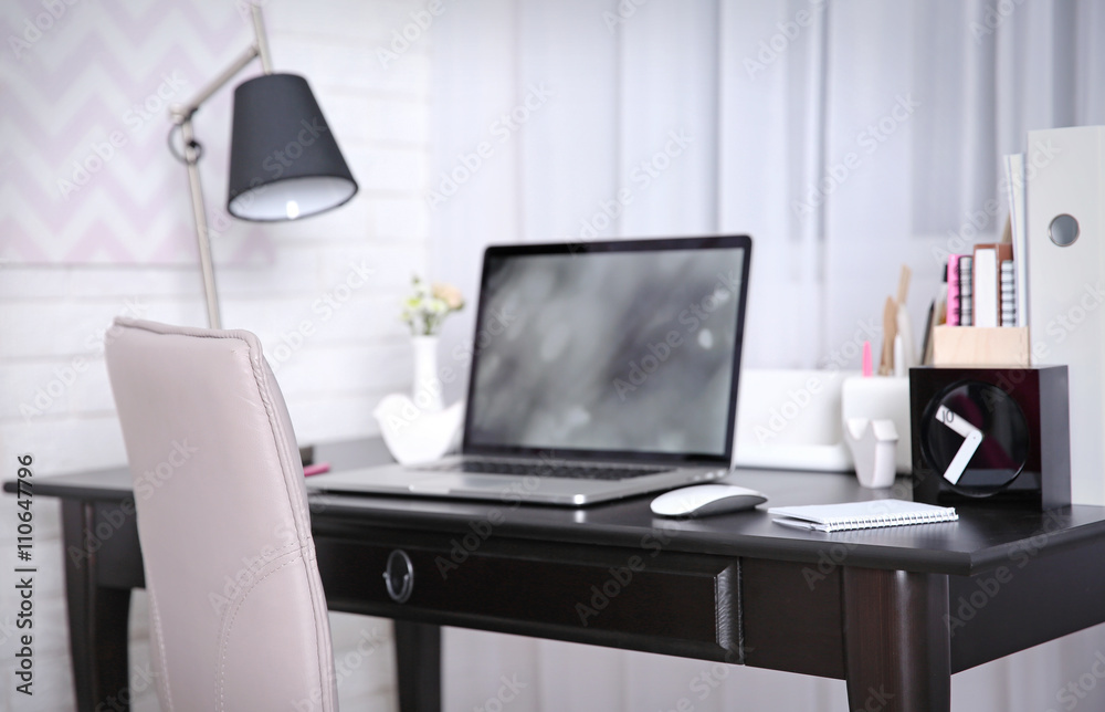 Fototapeta premium Workplace with laptop on table at home