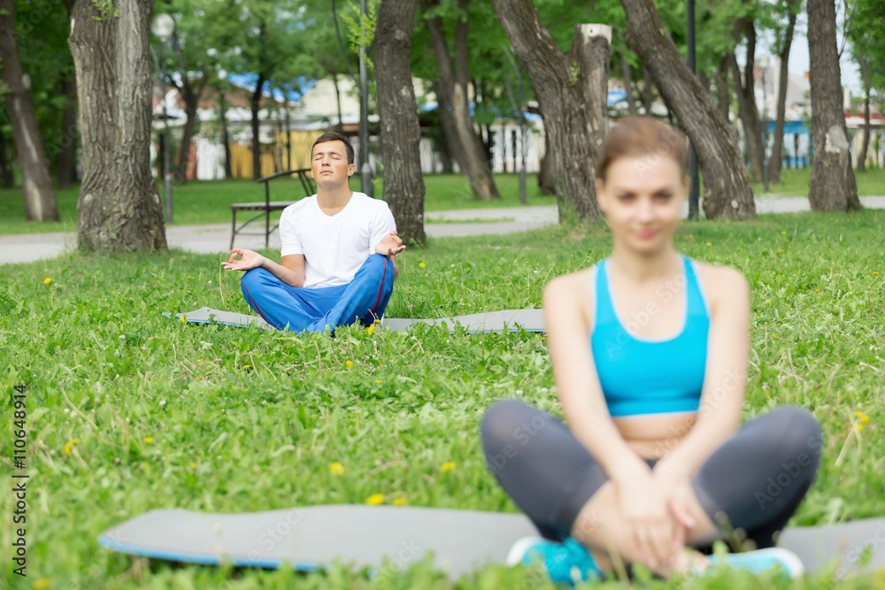 Having yoga practice in park
