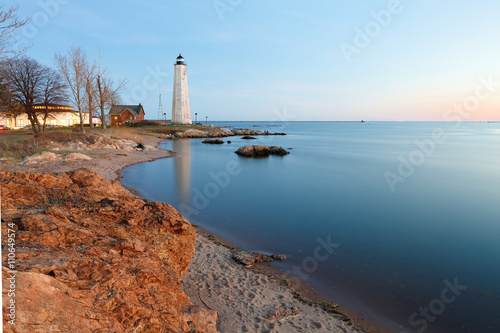 New Haven Light House at Lighthouse Point Park At Sunset. The lighthouse is dark, but the tower remains, greeting ships from around the world to New Haven. 