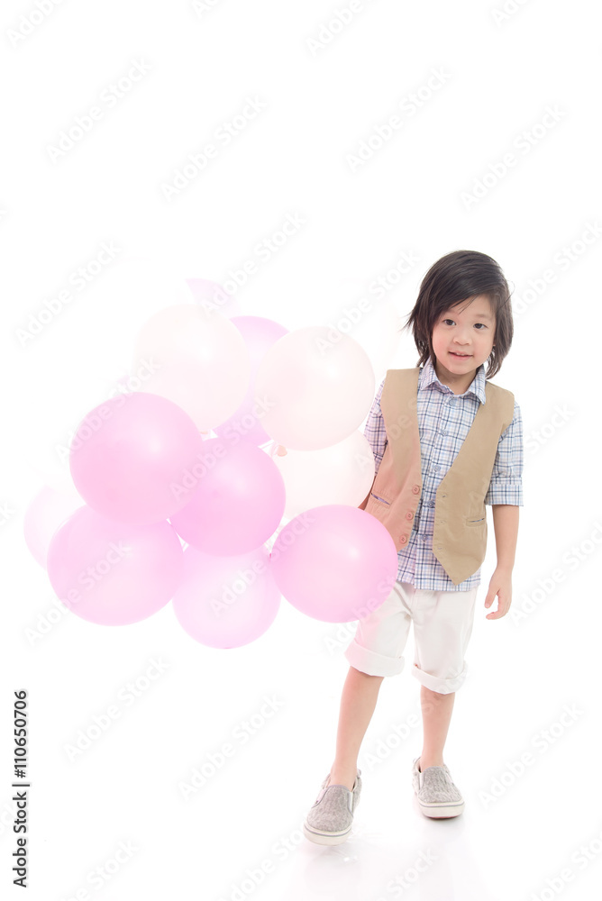 Asian child holding pink and white balloons Asian child holding pink and white balloons