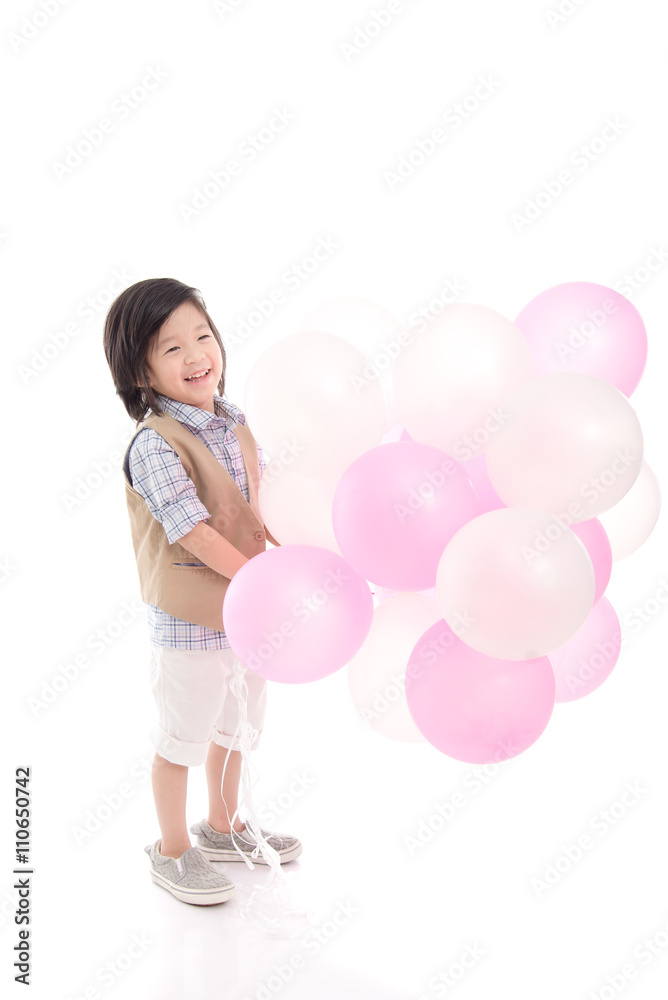 Asian child holding pink and white balloons Asian child holding pink and white balloons