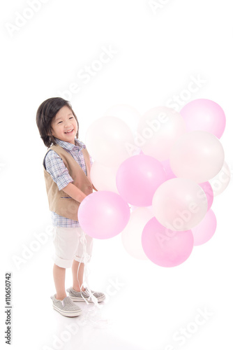 Asian child holding pink and white balloons © lalalululala