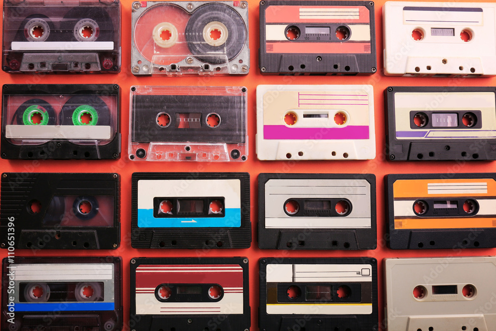 Set of old audio cassettes on red background Set of old audio cassettes on red background